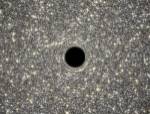 Artist's Concept of Giant Black Hole in Center of Ultracompact Galaxy by NASA, ESA, STScl