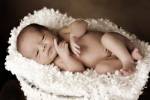 Baby Cuddling In White by Tanya Hovey