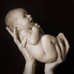 Baby Held Aloft by Tanya Hovey