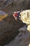 High Angle View of a Man hanging off of a Summit