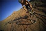 Low angle view of a man mountain biking, Utah, USA