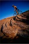 Low angle view of a man mountain biking, Utah, USA