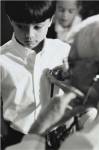 Male doctor listening to a boy's heartbeat