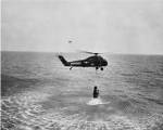 Marine helicopter lifting the astronaut spacecraft out of the Ocean