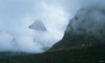 Misty Peak And Green Cliff by Gordon Semmens