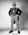 Senior man in an Uncle Sam Costume Standing with Arms Akimbo