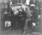 Thomas Alva Edison using his dicatating machine