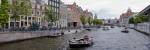 Tourboats in a canal, Amsterdam, Netherlands by Panoramic Images