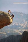 Two hikers with ropes at the edge of a cliff 2