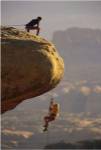 View of rock climbers on the edge of a cliff