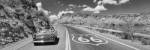 Vintage car moving on the road, Route 66, Arizona, USA by Panoramic Images