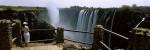 Woman looking at the Victoria Falls from a viewing point, Zambia by Panoramic Images