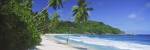 Woman walking on the beach, Anse Takamaka Beach, Mahe Island, Seychelles by Panoramic Images
