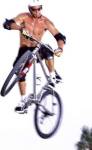 Young man on a bicycle in mid-air